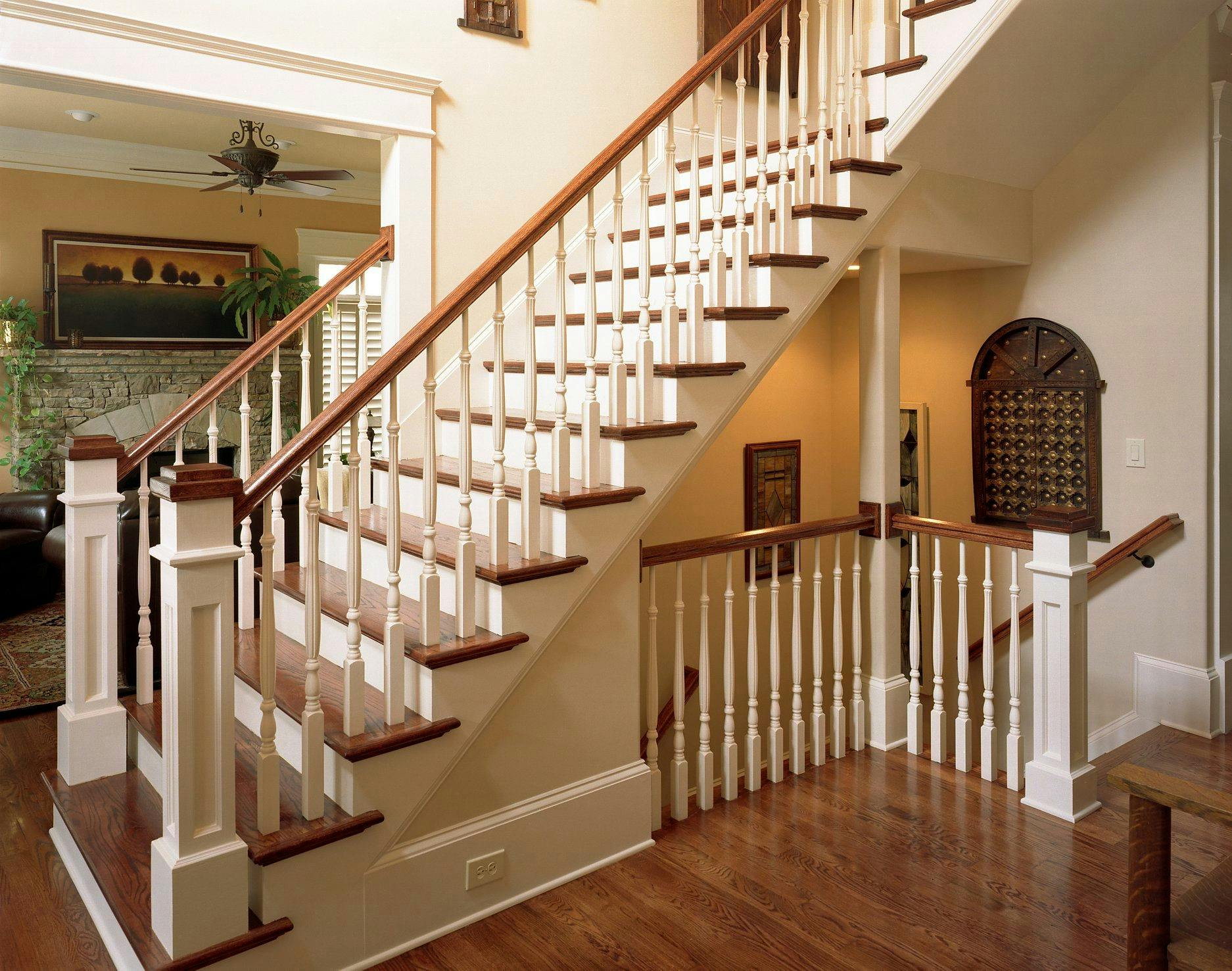 Finished staircase with wood treads and painted balusters
